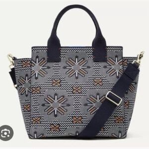 Navy with starburst design. Includes matching wristlet as a bundle.